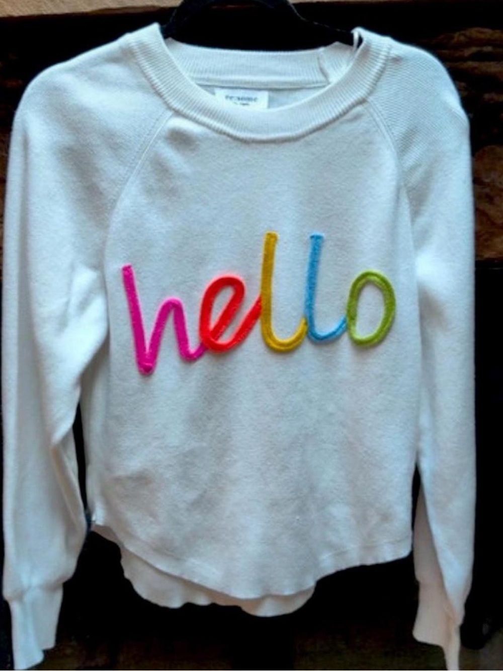 EE:Some "Hello" Cotton Crewneck Sweater with Multicolor appliqué stitching.